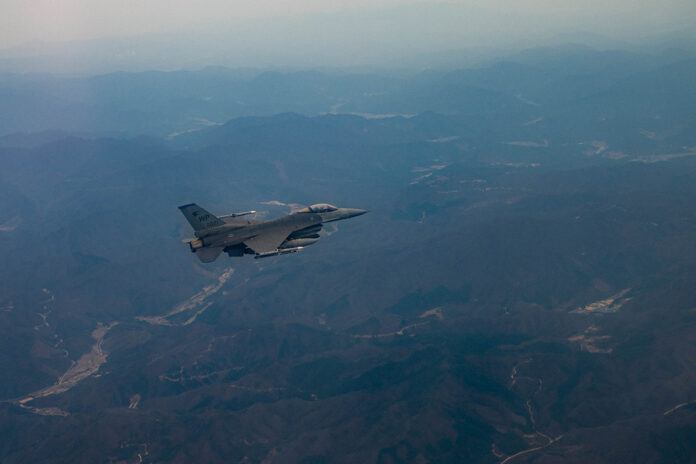A U.S. Air Force F-16 Fighting Falcon assigned to the 8th Fighter Wing, Kunsan Air Base, South Korea, flies over the Korean Peninsula, April 4, 2023. The Air Force Life Cycle Management Center and Post Block Integration Team project has provided the F-16 fleet with various modifications and upgrades since entering the Air Force inventory in 1979 including the most recent large-scale upgrade encompassing 22 combined modifications that increase survivability and accuracy of the weapon system.
