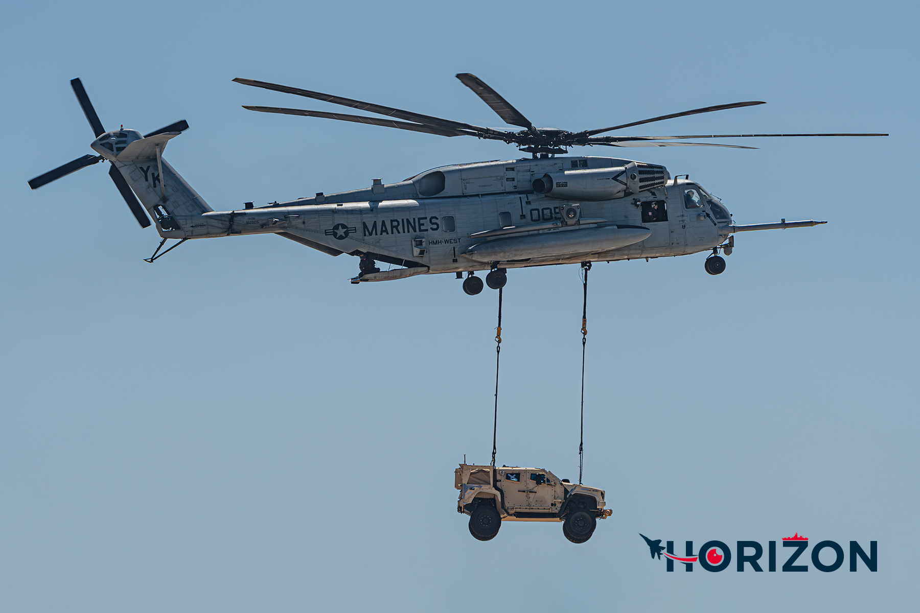 US Marine Corps CH-53E Super Stallion from Marine Heavy Helicopter Squadron 466 "Wolfpacks" (HMH-466) carrying a Joint Light Tactical Vehicle