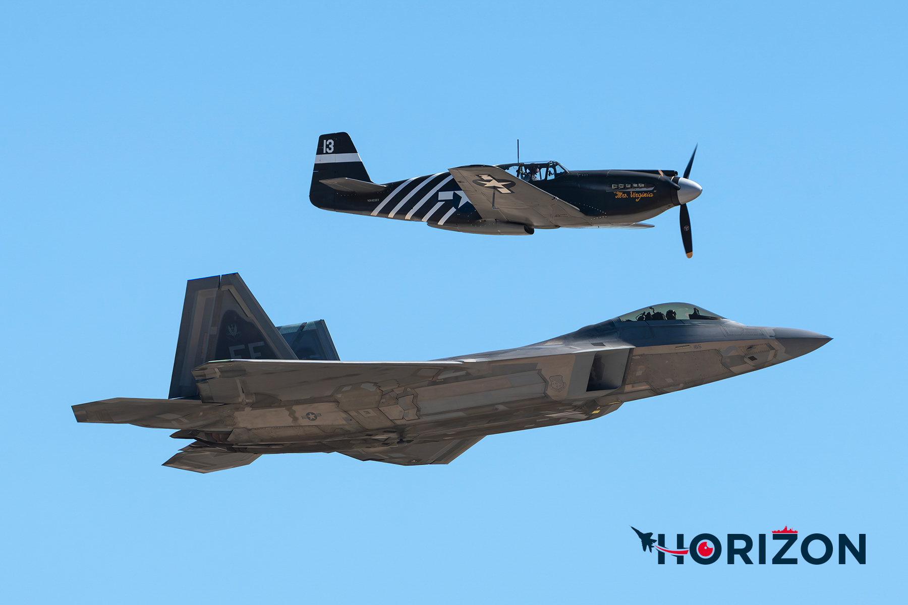 United States Air Force F-22 following alongside a Planes of Fame Museum P-51 during the Heritage Flight