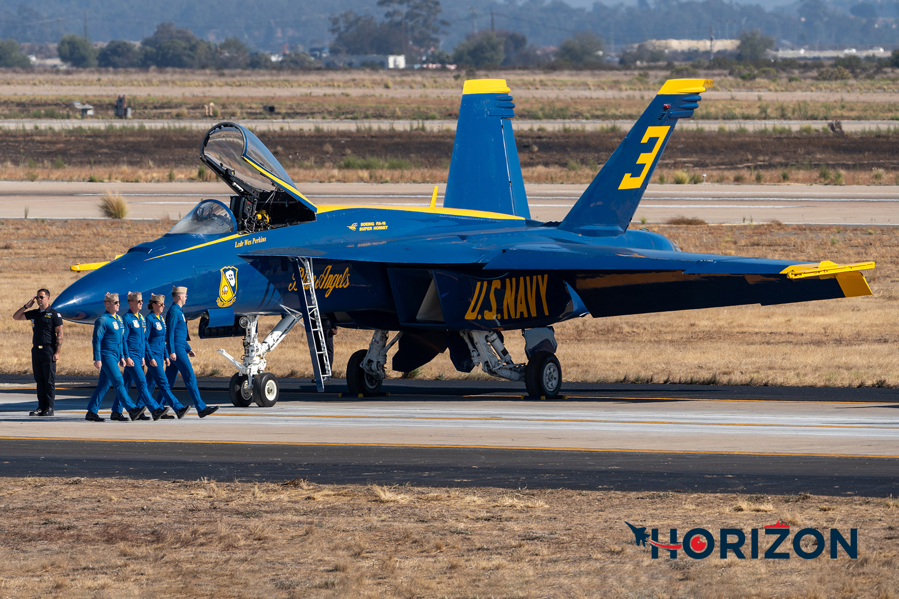 The Left Wing LCDR Wes Perkins entering the aircraft at the start of the show